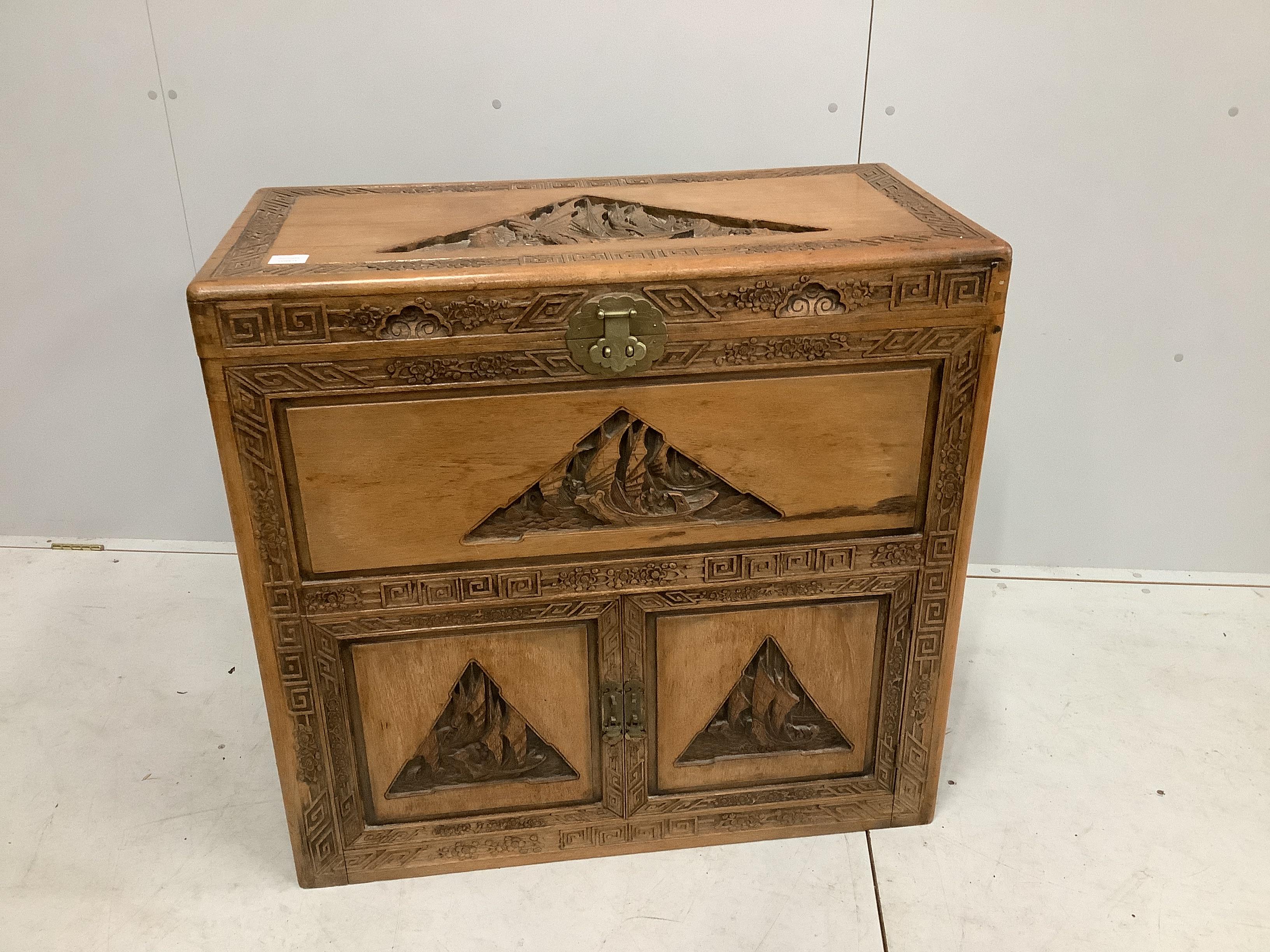 A Cantonese carved camphorwood trunk, width 91cm, depth 45cm, height 86cm